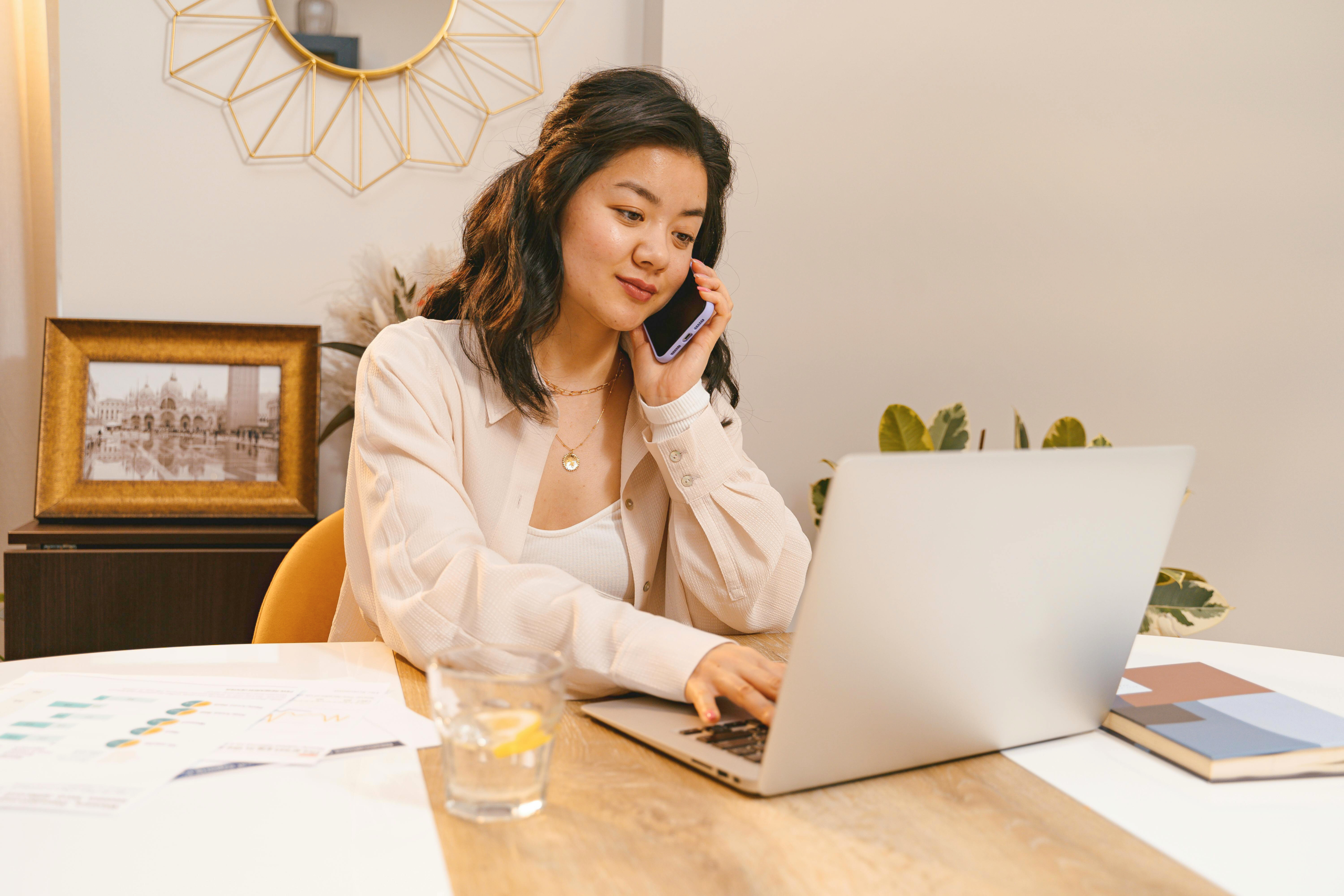 Adult working on laptop from home side hustle in 2025