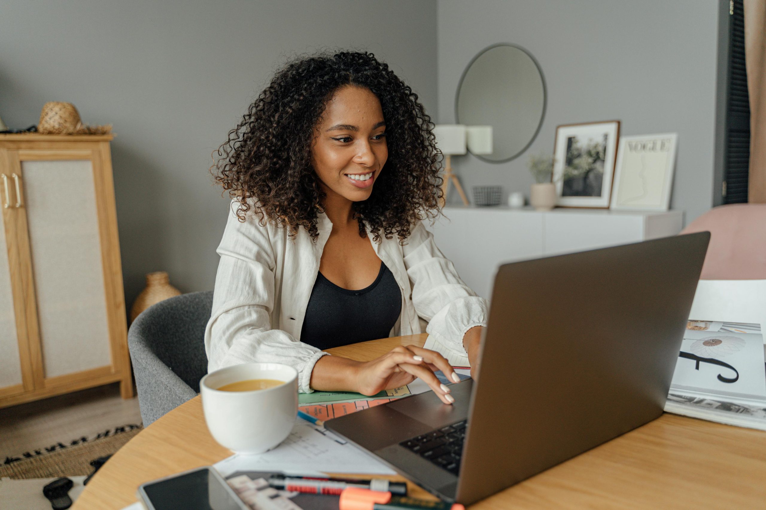 Teen working on a laptop at home