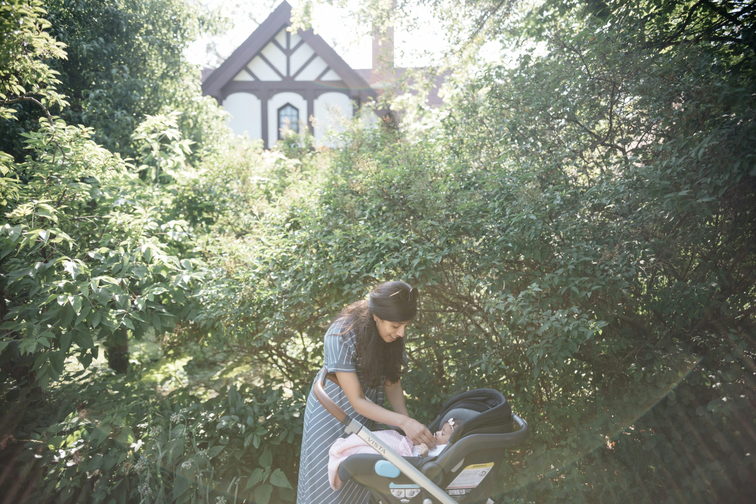 Teen babysitting outdoors with stroller